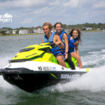three people on a jet ski in ocean city